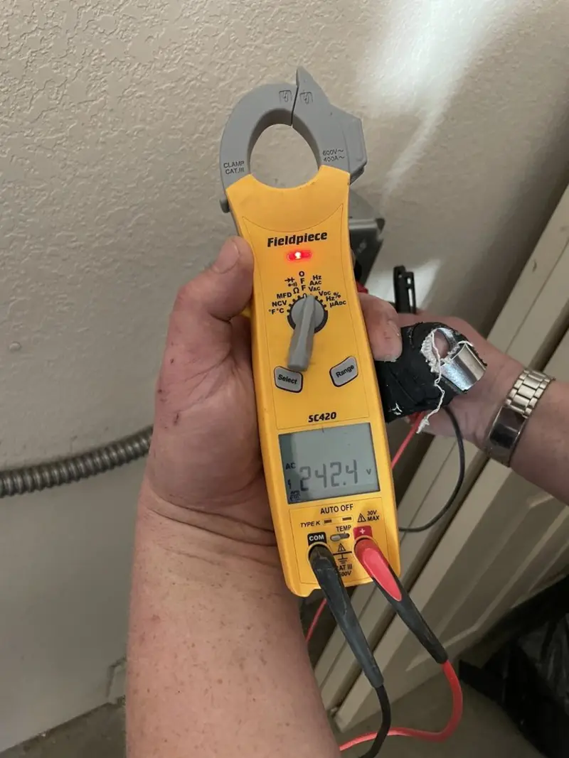 Voltage testing with clamp meter during Generator Installation in Clinton